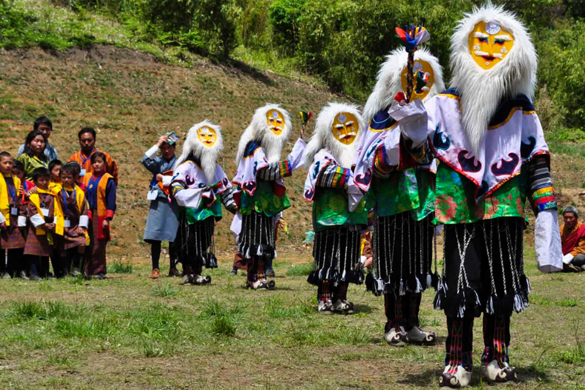 Masked Dancers at Rhododendron Festival in Bhutan